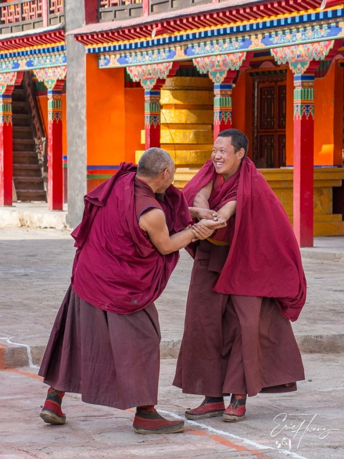 A brief moment of levity between two monks